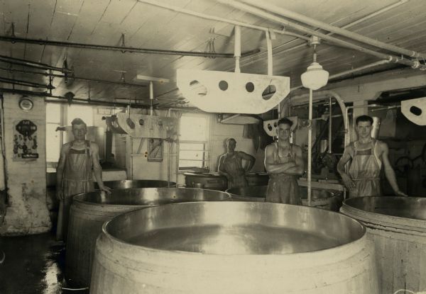 Men work at the Coldren Cheese Factory.