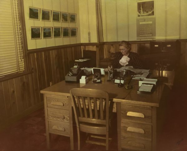 Laura Carney, the office bookkeeper of Brodhead Cheese, at her desk.