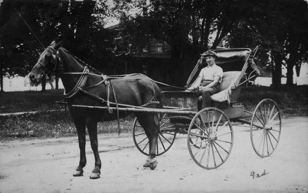 Casper Jaggi in a horse-drawn buggy.