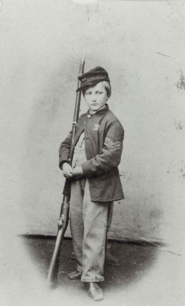Full-length portrait of John Clem, 22nd Michigan Volunteer Infantry, the "Drummer Boy of Shiloh".