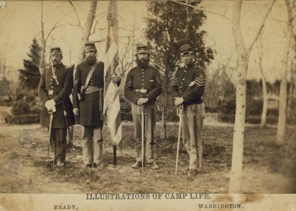From "Illustrations of Camp Life" with four soldiers of the 97th New York Volunteer Infantry with a unit flag.