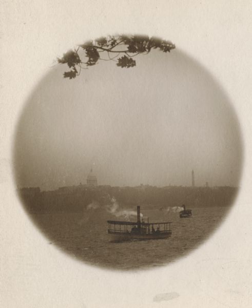 Wisconsin Capital from the shores of Lake Mendota, with two steamboats crossing the lake.