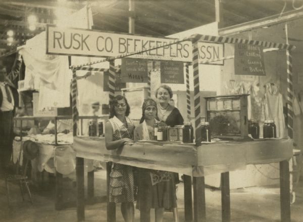 Three of the wives of the Rusk County Beekeepers Association. From left to right they are the wives of Robert Knudtson, Leslie Yancey, and A.D. Calkins.