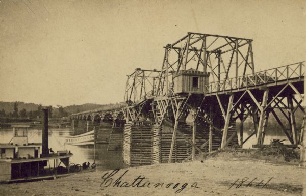 Carte-de-visite of a bridge at Chattanooga with a steamship passing nearby.