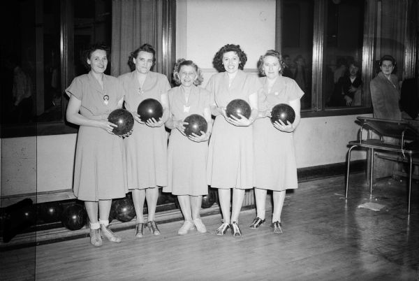 Bowling team composed of members of Local 75, United Automobile Workers (Seaman Body Company. Left to right: Myrtle Rohloff, Hilda Lange, Tillie Stowasser, two unknown individuals. 