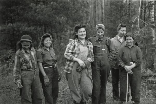 Ribes eradication crew of Indian women on the Menominee Reservation pose together in a line.