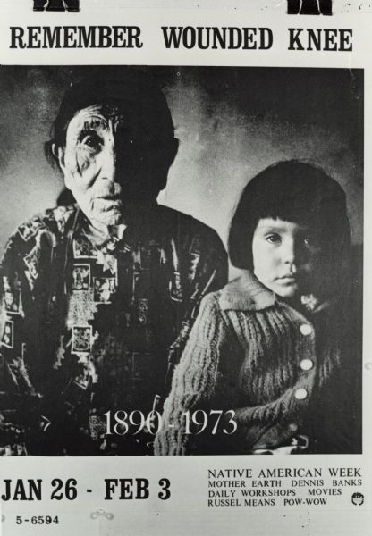 Poster of woman and child that says "Remember Wounded Knee".