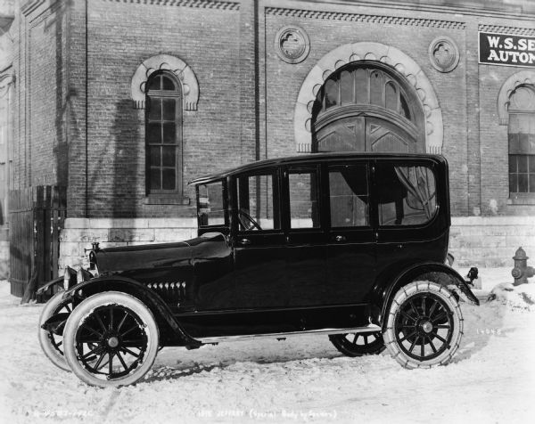 A 1915 Jeffery, with a special body made by the W.S. Seaman Company parked in front of the company's Milwaukee plant.  The Seaman company manufactured bodies for a number of early manufacturers of automobiles, trucks, buses, and ambulances. The Jeffery was an automobile make manufactured by the Thomas B. Jeffery Company of Kenosha.  The company was better known for its Rambler line, but after the death of founder Thomas Jeffery, his heir renamed the product in his memory. Eventually both the Jeffery and Seaman companies became part of Nash Motors.