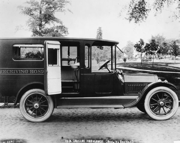 A 1914 Cadillac Ambulance in a park.  It's body was produced by the W.S. Seaman Company.