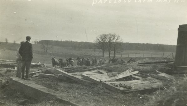 Horses among the ruins of the Papgleco Farm after it was hit by a tornado.