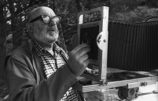 Ansel Adams adjusts the exposure prior to making a photograph with his 8 x 10 field camera at Point Lobos.