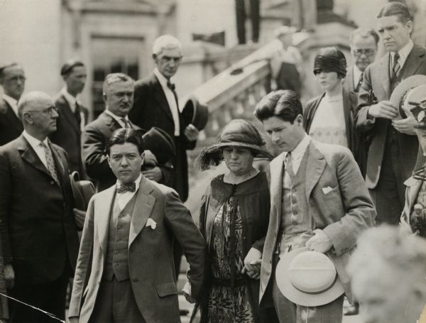 Robert, Jr., Belle Case, and Philip La Follette in foreground; Mr. and Mrs. Ralph Sucher follow, and George Middleton in background. To the left: E.N. Warner, J.B. Christoph, and Andrew C. Nielson.