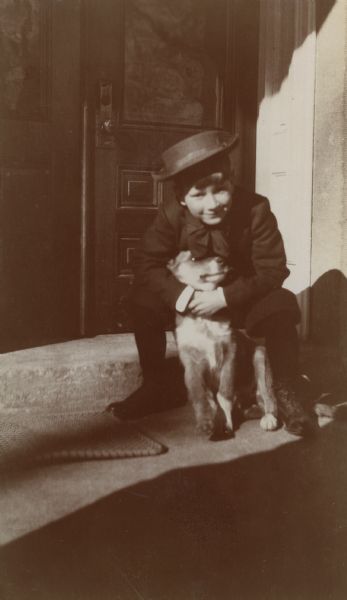 Philip La Follette on the porch of the Executive Residence with his dog Scotchie.
