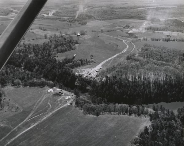 Aerial view of the construction of the interstate highway near Mirror Lake, showing only the early stages of the bridge construction.