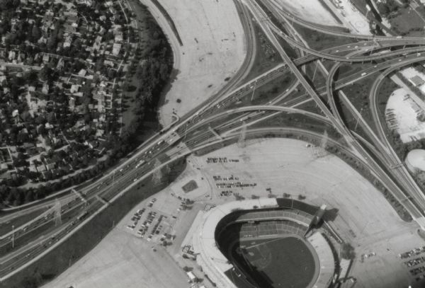 Aerial view of Milwaukee County Stadium and the intersection of US 41 and I-94.  County Stadium was built in 1953 and demolished in 2001.  Although undated, this photograph was taken after the stadium expansion completed in 1975.
