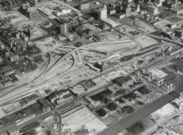 Aerial view of early construction at the Marquette Interchange in Milwaukee, the junction of Interstate Highways I94 and I43.  Construction began in 1964, although planning for a Milwaukee freeway predated President Eisenhower's signing of the Highway Act of 1956.  Construction was completed in 1968.