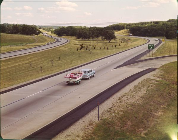 At many places in Wisconsin, the Interstate Highway is divided by a wide median strip that provides a scenic view for the motorist.  This photograph shows a section I-90/94 in Sauk County.  Such scenery was judged so picturesque to potential visitors that the state Division of Tourism took this photograph for publicity purposes.