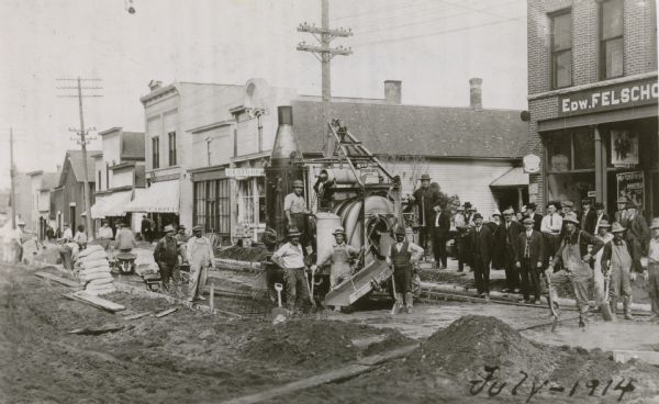 Paving the main street with concrete was an occasion that brought out a large part of the Clintonville community to watch.