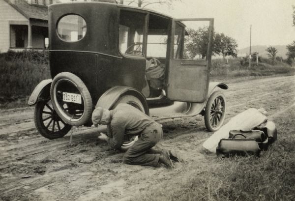Tire blowouts were a frequent hazard of early automobile travel.