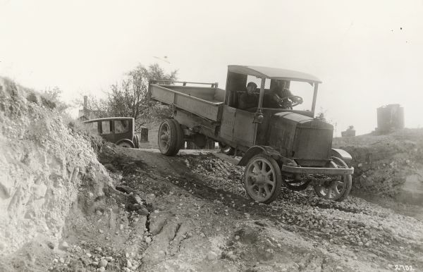 Kissel truck owned by Washington County entering a gravel pit.