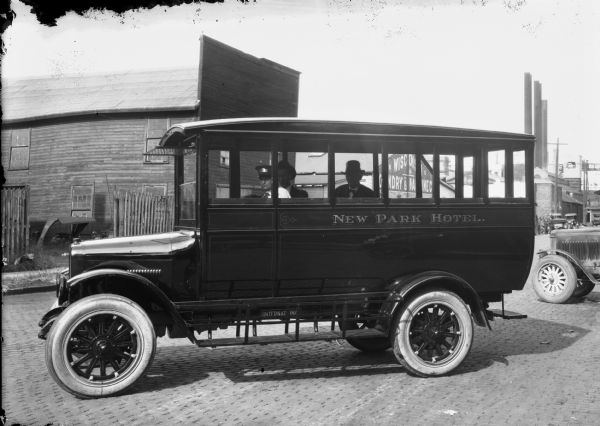 International Harvester-made bus of the Park Hotel, probably photographed near the railroad station where it was picking up passengers. This small jitney-type bus was typical of the buses manufactured by International.