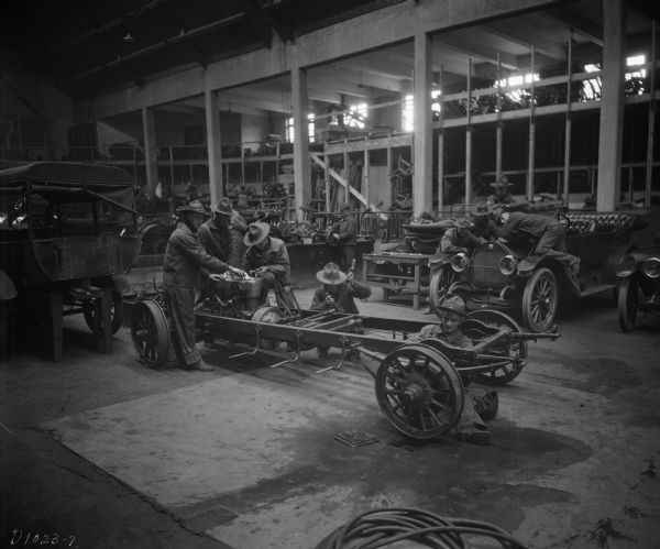 Training classes for University of Wisconsin student cadets in the repair of automobiles and trucks during World War I.