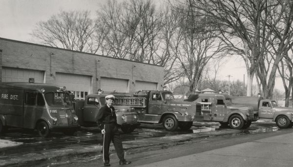 Albert Derleth, chief of the Sauk City Fire Department, and the department's fleet of equipment.