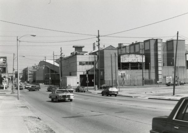 One of a group of photographs taken to document the appearance of the Chrysler Company plant in Kenosha in 1989.  The factory, which was then the oldest automobile plant in the nation, was built in 1917 by the Nash Motors Company.  It was subsequently owned by American Motors which was acquired by Chrysler in 1987.  Chrysler ended vehicle production in Kenosha at the end of 1988 despite a previous promise not to do so, thereby laying off 4800 workers.  More recently, automobile engines have been manufactured at the plant.