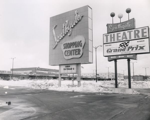 Entrance to the Southgate Shopping Center, Theatre, and parking lot.  The proximity of parking to the stores in suburban shopping centers was one of the primary reasons for the decline of downtown shopping districts beginning in the 1950s.  The theatre is showing John Frankenheimer's "Grand Prix Cinerama," which some consider the greatest automobile racing film.