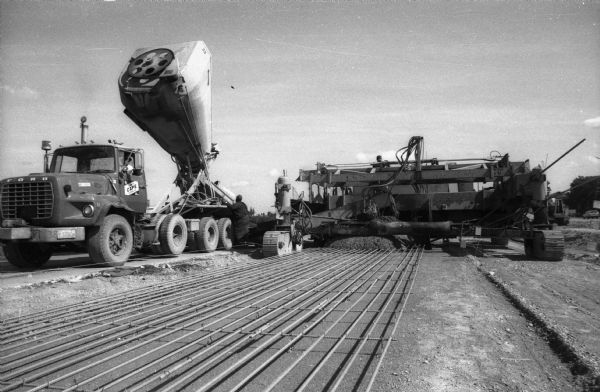 A Ford Truck cement mixer delivers concrete for a pour during  construction on one of the Wisconsin Interstate Highways.