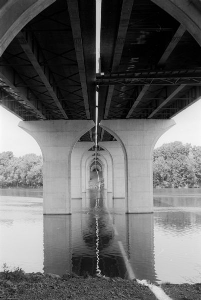View from below of the Fox River Bridge. Gordon Neitzke who photographed the Fox River Bridge for the Wisconsin Department of Highways, found an almost cathedral-like beauty in the underside of the structure.