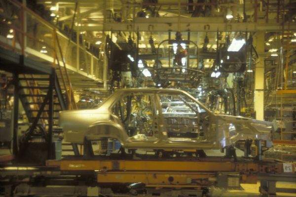 An automobile frame on the assembly line at the General Motors plant.