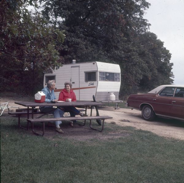 Campers at Governor Dodge State Park with their trailer.
