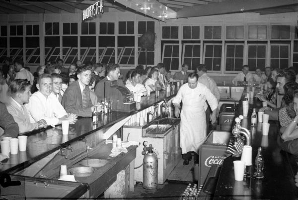 Employees of the Seaman's Body Corporation gather at the bar during their annual Harvest Dance.