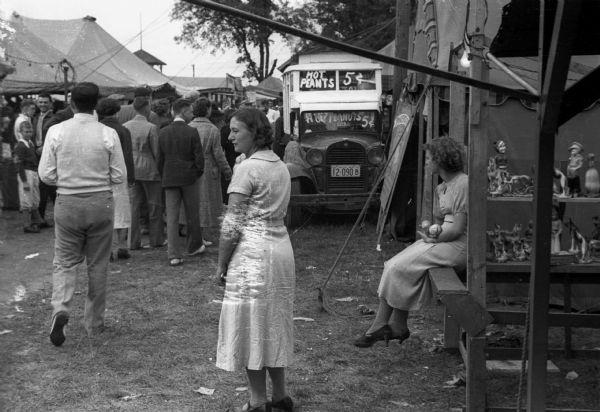 Midway area of the Wisconsin State Fair, showing a truck advertising peanuts at 5 cents in the center background.