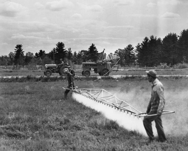 Boom spraying of cranberries, in the Wisconsin Rapids area and probably by members of the Asa Bennett family. This technique using a tractor was developed about 1940.