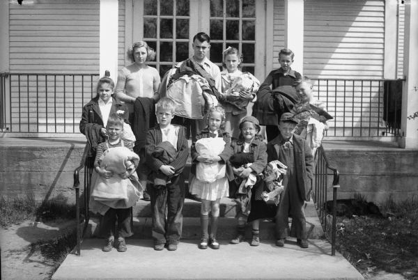 Pupils of the Highlands-Mendota Beach School ran a clothing drive contest among school rooms and collected well over a truckload of clothing. Pictured are the room captains. Left to right in the first row are Ronnie Merrick, Donald West, Kitty Dubielzig, Carol Kaeser, and Robert Pigorsch. From left to right in the second row are Nancy Thomsen, Jeanette Becker, Douglas Stone, Caroline Forsmo, Robert Rosa and Bruce Johnson.
