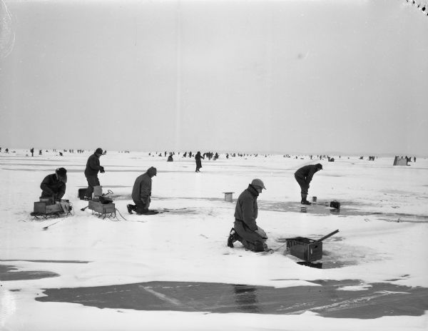 Ice fishing on Lake Mendota. A traffic problem was created in the village of Maple Bluff during the weekend when hundreds of persons from all parts of southern Wisconsin descended on Lake Mendota to fish through the ice for perch and other pan fish.
