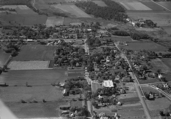 Aerial view of DeForest including residences and the surrounding countryside.