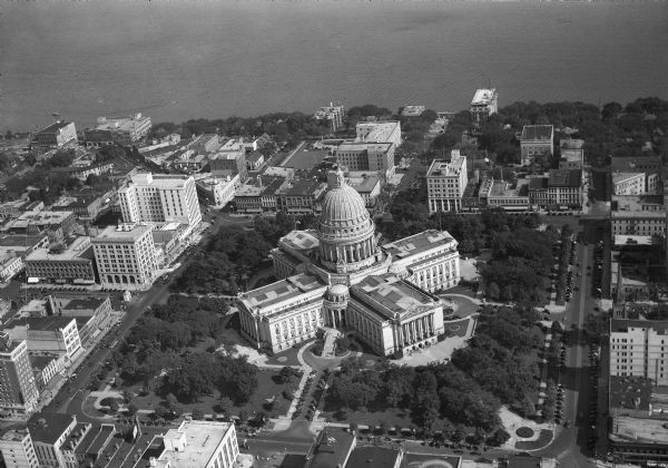 Aerial view of the Wisconsin State Capitol, the surrounding businesses, and Lake Monona.