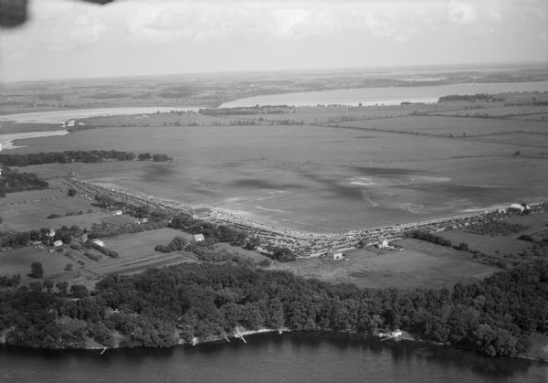 Aerial view of Pennco Field (Royal Airport), the shoreline of Lake Monona, and the surrounding countryside near the city limits.