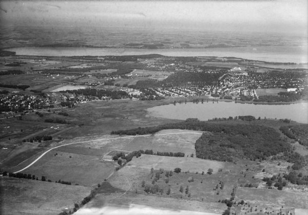Aerial view of the University of Wisconsin-Madison Arboretum including a portion of Lake Wingra and surrounding residential neighborhoods.