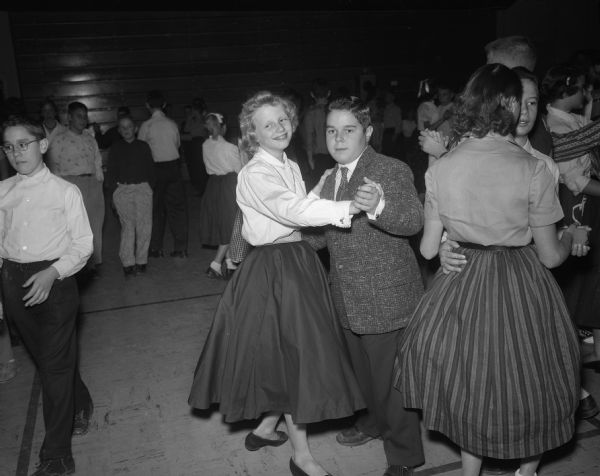 Student couples dancing at the Cherokee Heights School dance.  Included in the foreground are Donna Marshall and Larry Meicher.
