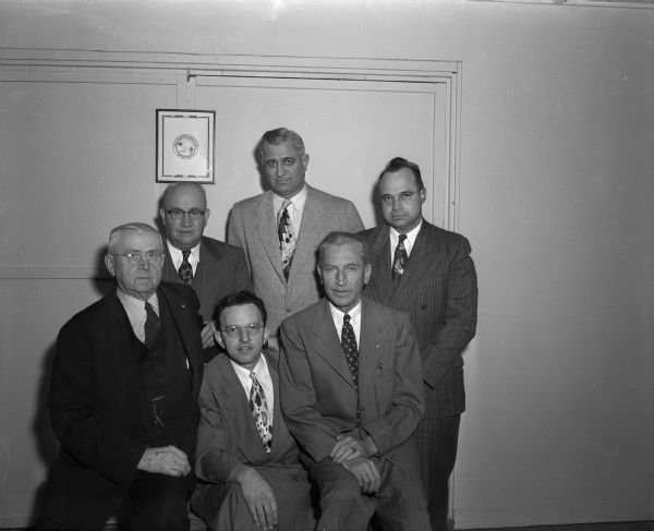 Newly installed officers of the West Side Benefit League which was organized by the West Side Business Men's Association to furnish immediate funds to the beneficiary of a deceased member of the association. Front row, left to right: John Blawusch, Secetary-Treasurer, Karl U. Rentschler, President, Adolph F. Mallatt, board member. Back row, left to right: D. Lee Watts, board member, Freeman Fox, past president, and Curtiss D. Brauhn, board member.