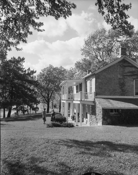 Bonnie Kienitz and Freda K. Winterble in front of the Petheridge/Isom/Keystone house, built in 1853.  The residence, located at 901 University Bay Drive, is owned by Freda Winterble and will be featured on the second annual house tour of the League of Women Voters in cooperation with the Madison Chapter of the Wisconsin Division of Architects.