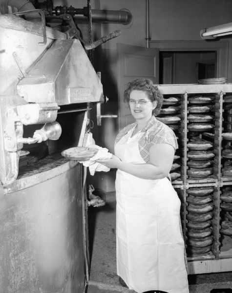 Edith Murray puts a pie in the oven at Bjelde Pie Shop, 302 North Frances Street. She is treasurer for Sweet Adelines of Madison.