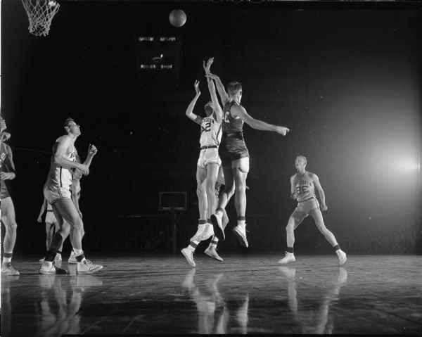 Wisconsin player number 54 attempts to make a basket during the University of Wisconsin vs. University of Indiana basketball game.
