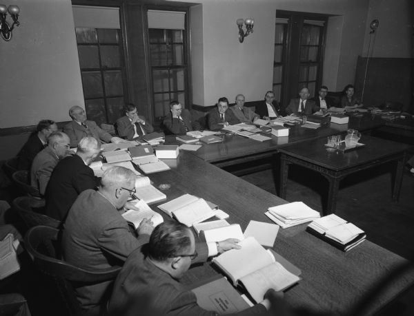 Joint Finance Committee of the 1952 Wisconsin Legislature listening to arguments for and against the $5,000,000 cut Governor Walter Kohler proposed in the University of Wisconsin budget request.