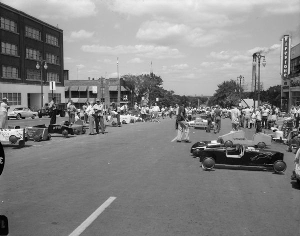The line-up of racers await their turn to race in the Madison Soap Box Derby. The Derby was on East Washington Avenue leading from the Wisconsin State Capitol.