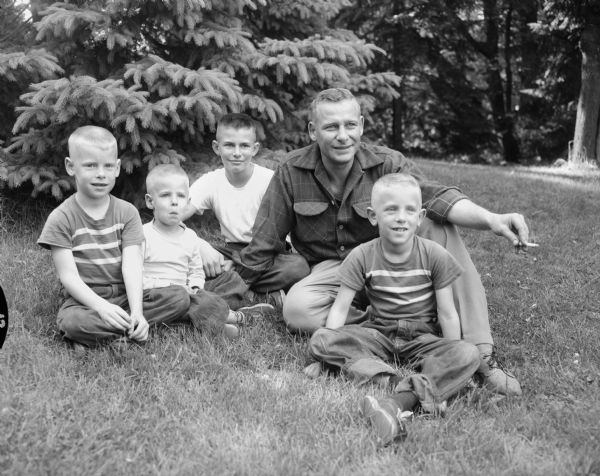 Arthur A. Vierthaler, University of Wisconsin assistant professor of art education, on the lawn of his Fox Bluff home with his four sons: Paul, Kurt, Erich, and Michael.